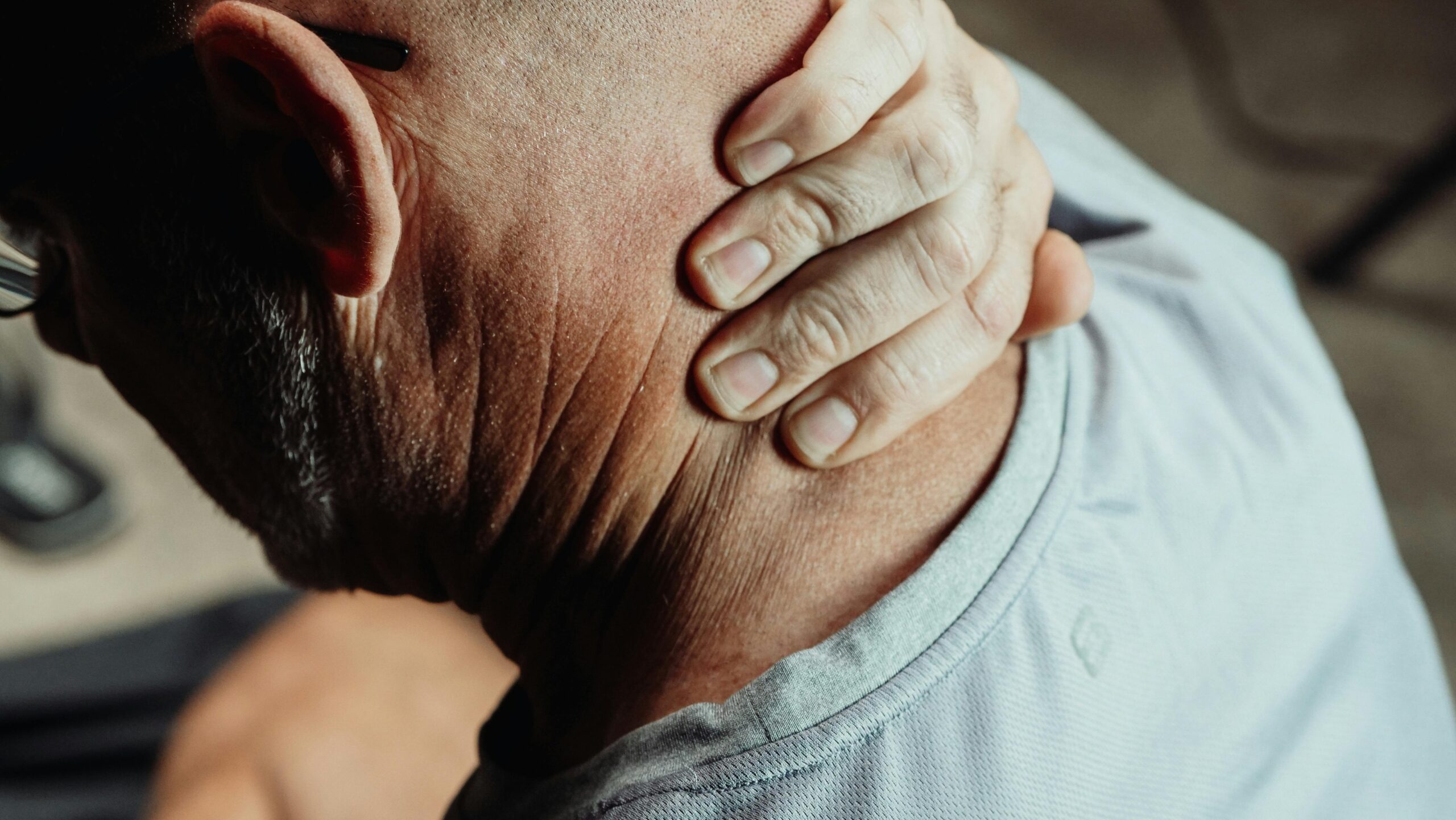 Physiotherapist assessing neck movement