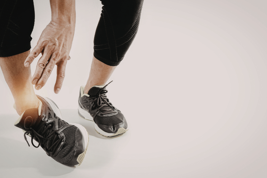 Physiotherapist assessing ankle pain